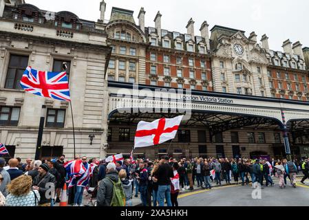 Groups such as English Defence League gathering outside London Victoria Station for protest march against such subjects as alleged two-tier policing Stock Photo