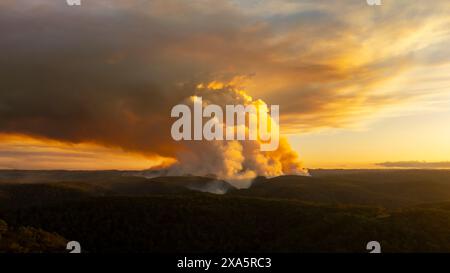 Drone aerial photograph of controlled bush fire hazard reduction burning by the Rural Fire Service in the Blue Mountains in NSW, Australia. Stock Photo