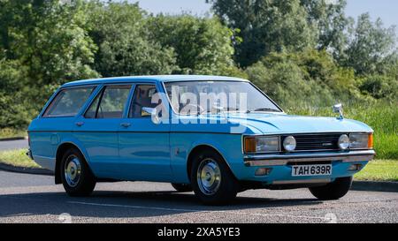 Stony Stratford,UK - June 2nd 2024: 1977 blue Ford Granada estate car driving on a British country road Stock Photo