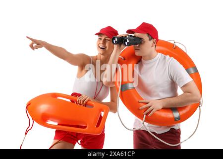 Lifeguards with ring buoy, rescue tube and binoculars spotted something on white background Stock Photo