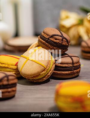 The Colorful macarons and assorted sweets displayed on a table Stock Photo