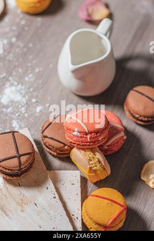 Colorful macarons and assorted sweets displayed on a table Stock Photo