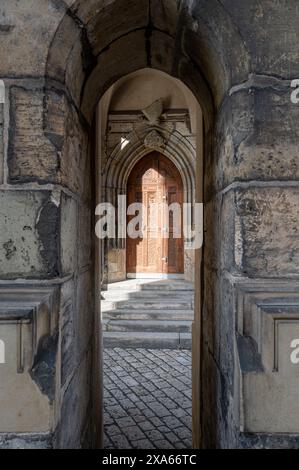 An open doorway flanked by stone pillars in the Old Town of Prague, Czech Republic Stock Photo