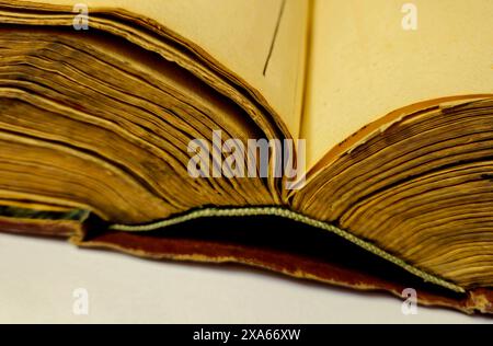 A close-up of an open book on a table Stock Photo