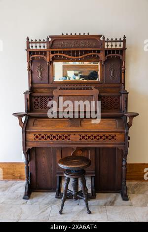 Old wooden piano keys on wooden musical instrument in front view Stock Photo