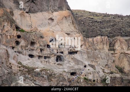 A scenic view of Vardzia caves nestled in a cliffside Stock Photo