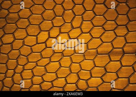 Abstract grunge wooden brown background with hexagonal. Honeycombs fractal seamless pattern texture. Golden surface of a wall. Decorative elements. Stock Photo