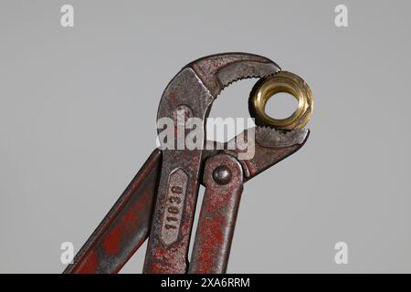 Macro shot of an old pipe wrench covered in rust Stock Photo