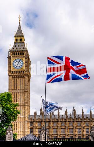 A Union Flag (aka Union Jack) Flying Next To Big Ben (aka Queen Elizabeth Tower) Westminster, London, UK. Stock Photo