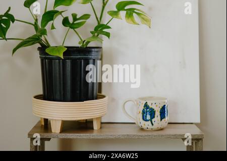 The beautiful hand-made ceramic mug displayed on the table Stock Photo