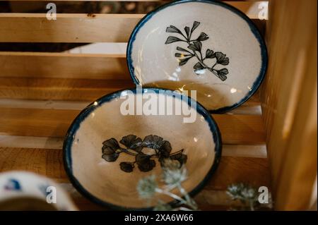 The beautiful hand-made ceramic plates with plants Stock Photo