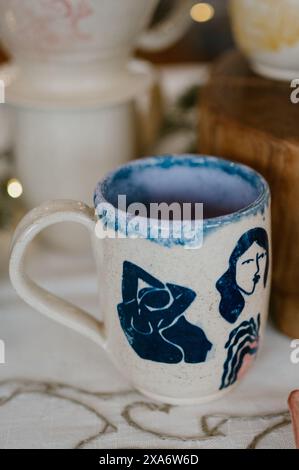 A cute hand-made mug with beautiful decorations Stock Photo