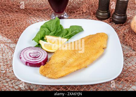 Fried salmon with corn tortillas flavored with cornmeal. Pieces of fried fish coated in cornmeal. Salmon fillet cooked in cornmeal. Stock Photo