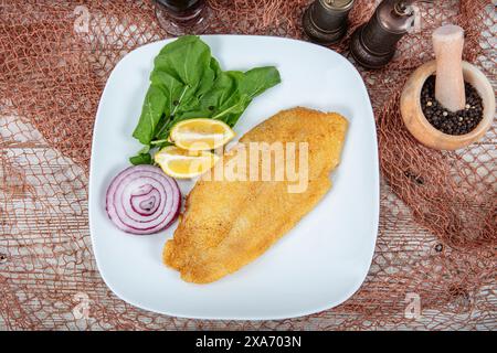 Fried salmon with corn tortillas flavored with cornmeal. Pieces of fried fish coated in cornmeal. Salmon fillet cooked in cornmeal. Stock Photo