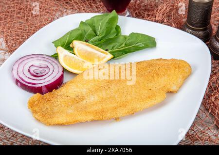 Fried salmon with corn tortillas flavored with cornmeal. Pieces of fried fish coated in cornmeal. Salmon fillet cooked in cornmeal. Stock Photo