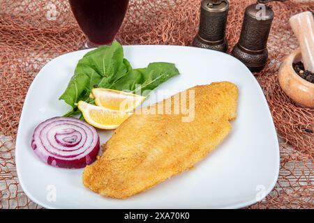 Fried salmon with corn tortillas flavored with cornmeal. Pieces of fried fish coated in cornmeal. Salmon fillet cooked in cornmeal. Stock Photo
