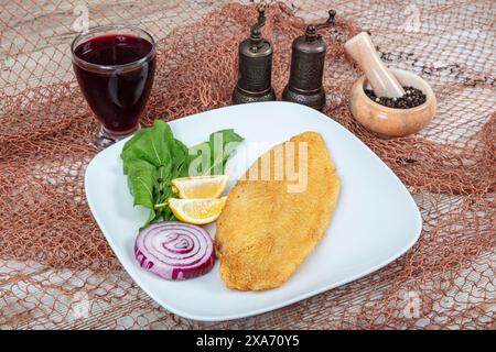 Fried salmon with corn tortillas flavored with cornmeal. Pieces of fried fish coated in cornmeal. Salmon fillet cooked in cornmeal. Stock Photo