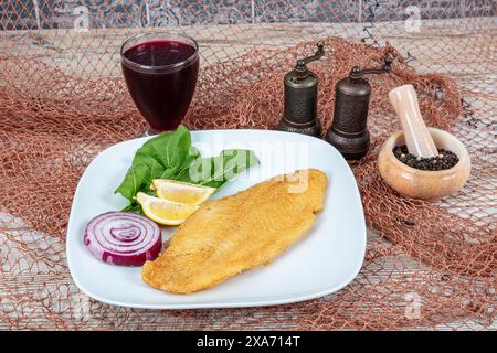Fried salmon with corn tortillas flavored with cornmeal. Pieces of fried fish coated in cornmeal. Salmon fillet cooked in cornmeal. Stock Photo