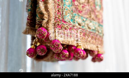 Several vibrant fabric drapes on a clothesline Stock Photo