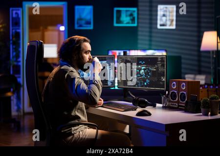 Software developer drinking coffee, watching AI on screen gaining humanoid form and consciousness. Computer scientist consuming hot beverage, seeing artificial intelligence materializing on monitor Stock Photo
