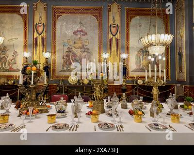 Elegantly set dining table with multiple plates Stock Photo