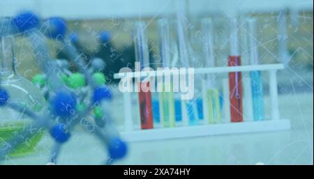 Image of mathematical and scientific formulas over chemistry laboratory Stock Photo