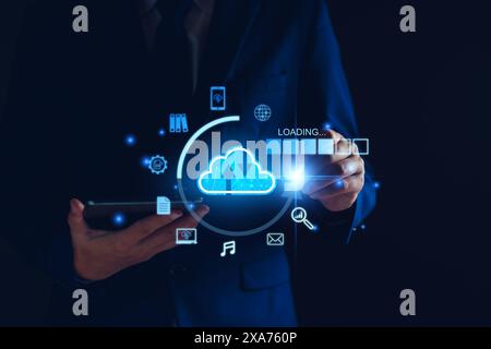 Data download from cloud computing concept. Man using smartphone and computer to download, upload business information, media files. Cloud computing t Stock Photo