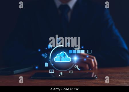 Data download from cloud computing concept. Man using smartphone and computer to download, upload business information, media files. Cloud computing t Stock Photo