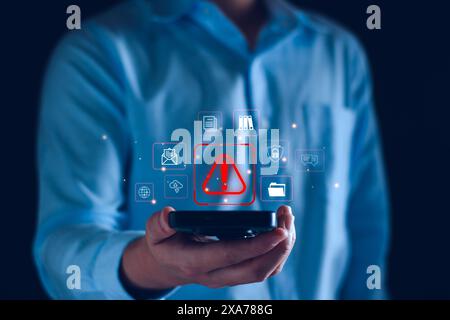 System warning hacked alert, cyber attack on computer network. programmer, Businessman staff, developer using technology with triangle caution warning Stock Photo