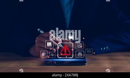 Businessman staff, programmer, developer using technology with triangle caution warning sign notification error and maintenance concept. System warnin Stock Photo