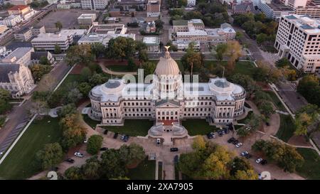 Jackson, Mississippi, USA - April 23, 2024: Sunset light shines on the historic Capitol and  buildings of downtown Jackson skyline. Stock Photo