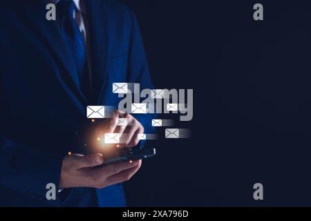 Businessman sending email by smartphone to customer, business contact and communication, email icon, email marketing concept, send e-mail or newslette Stock Photo