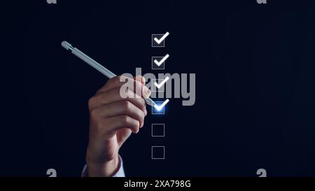 Check list, Businessman Take an assessment, questionnaire, evaluation, online survey exam Choosing the right answer in the exam, filling out an online Stock Photo