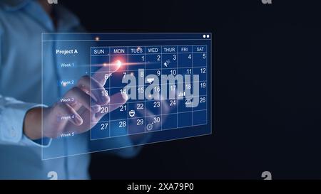 Work planning and business project management concept, virtual calendar screen and updating tasks and milestones progress planning to improve time man Stock Photo