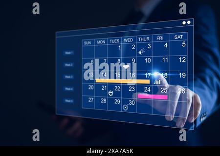 Work planning and business project management concept, virtual calendar screen and updating tasks and milestones progress planning to improve time man Stock Photo