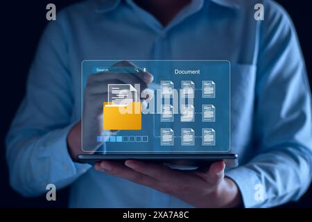 Document management and network system concept. Businessman use smart tablet loading documents in online archives ,Document management Storage and tec Stock Photo
