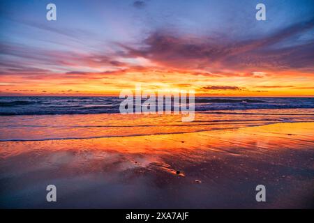Sunset at sea with cloudy sky Stock Photo