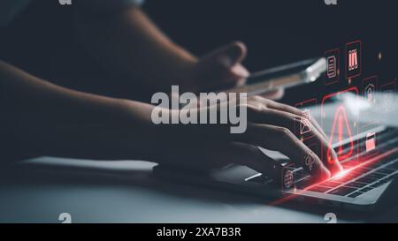 System warning hacked alert, cyber attack on computer network. programmer, Businessman staff, developer using technology with triangle caution warning Stock Photo