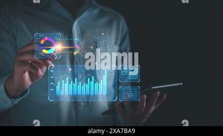 KPI business analysis concept. Businessman using KPI dashboard virtual screen analyze data report, business tend, marketing, company finances, investm Stock Photo