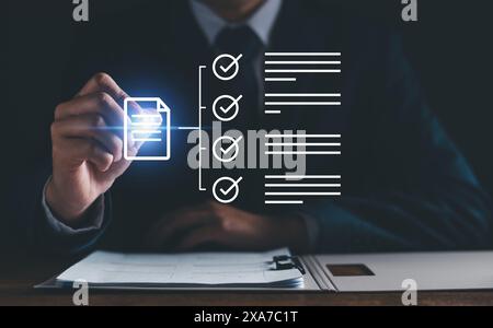 Document management concept, Businessman check electronic documents, survey filling out. digital form checklist on virtual screen Document Management Stock Photo