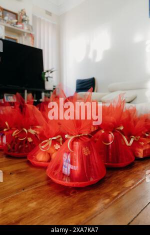 Numerous red bows and festive decorations on a table Stock Photo