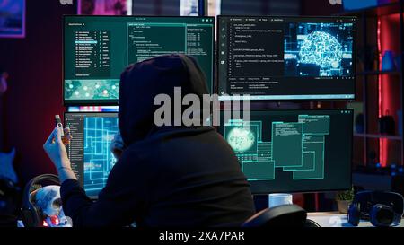 Hacker inserting USB in computer after managing to steal sensitive data, close up. Scammer uploading storage drive into PC after obtaining sensitive information from users using malware, camera A Stock Photo