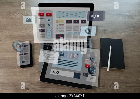 Creative web content design studio with flying website page layout seo technology businessman hand design on laptop designs for mobile app Stock Photo