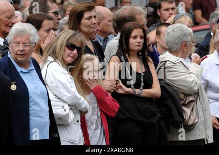 The scene in Wootton Bassett, Wiltshire today as the bodies of five service men killed in Afghanistan are repatriated to the UK. Crowds of family members, friends and members of the public lined the streets to pay their respects to the fallen on their return to the UK. 10/7/2009 Stock Photo