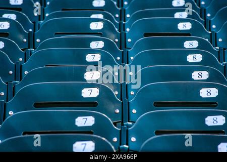 Rows of empty seats in a baseball stadium Stock Photo