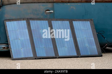 Set of portable and foldable solar panels for charging of small electronical devices while travelling Stock Photo