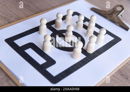 Football tactical clipboard on wooden table. Football formations, strategy and tactical concept. Stock Photo