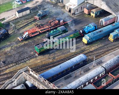 Freight trains parked near terminals on tracks Stock Photo
