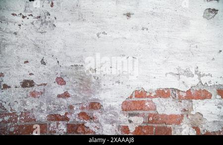 A white brick and orange brick wall. A white painted old brick wall background Stock Photo
