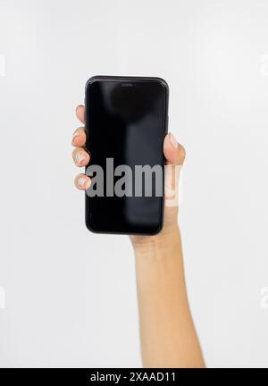 Hands Holding a Smartphone in a Detailed Close-up Shot Stock Photo